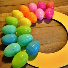 PRETTY PLASTIC EGG WREATH | Raising Kinley Easter Dyi, Easter Egg Wreath Diy, Egg Wreath, Easter Wreath Diy, Easter Stuff, Easter Egg Wreath, Plastic Easter Eggs, Spring Easter Crafts, Easter Egg Crafts