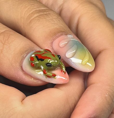 Dive into a world of enchantment with our latest 3D amphibian-inspired nails! Each nail tells a story, with intricate designs that leap right off the tip. Ready to make a splash? “ #NailArt #3DNails #AmphibianArt #CreativityAtYourFingertips #NailTechLife #ManicureMagic #BoldNails #ArtisticNails #InnovativeNails Enchanted Nails, Cartoon Nails, Inspired Nails, Animal Nails, Animal Cartoon, 3d Nails, Intricate Designs, Nail Tech, Animal Design