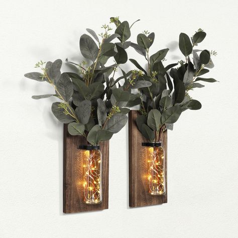 PRICES MAY VARY. RUSTIC WOOD FARMHOUSE WALL DECOR: The package includes 2 pack wood wall glass vases and 2 string lights. Our wall-hanging wood wall planter is thoughtfully designed to be both functional and visually appealing. The floating design gives it a natural and rustic look, allowing it to blend seamlessly into any room wall decor. They are perfect for a space that needs to be topped off with some gorgeous simplicity, like wood tones and greenery! ROMANTIC ATMOSPHERE: From rustic and chi Farmhouse Sconces, Wood Farmhouse Decor, Farmhouse Wall Decor Living Room, Wall Sconces Farmhouse, Wall Decor For Bathroom, Glass Wall Vase, Planters For Indoor Plants, Farmhouse Vase, Decor For Bathroom