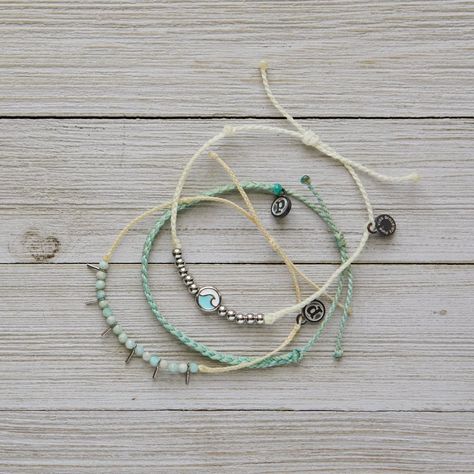 This Set From Pura Vida Comes With Three Bracelets; A White String Bracelet With Silver Beads And Turquoise + Silver Ocean Wave Charm, A Mint Mini Braided Bracelet, And A Cream String Bracelet With Sea Glass Beads And Silver Spike Details. Nwot: The Item Is In Perfect Condition - 100% Waterproof - Wax Coated - Adjustable From 2-5 Inches In Diameter Please Reach Out With Any Questions On This Item! . Bundle + Save! Enjoy 15% Off When You Purchase Two Or More Items From My Closet Bohemian | Festiv Sea Glass Beads, Bracelet Pack, Festival Concert, Bohemian Festival, Pura Vida Bracelets, Braided Bracelet, Bracelet Ideas, Ocean Wave, String Bracelet