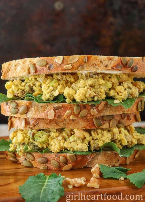 This delicious Chickpea Salad Sandwich is flavoured with curry, dried apricots and walnuts. It's made in about 10 minutes and makes for a satisfying, easy lunch! #chickpeasaladsandwich #curriedchickpeasalad #chickpeasandwich #mashedchickpeasandwich #easysandwichrecipe Curry Chickpea Salad, Curried Chickpea Salad, Chickpea Salad Sandwich, Sandwich Ingredients, Vegetarian Sandwich, Chickpea Recipes, Chickpea Curry, Vegetarian Lunch, Vegan Sandwich