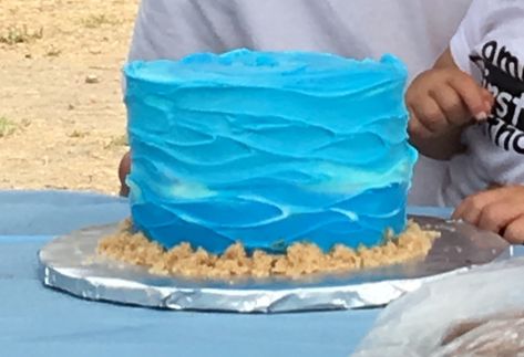 Ocean themed under the sea smash cake Ocean Smash Cake, Sea Smash Cake, Under The Sea Smash Cake, Ocean Birthday Cakes, Wave Cake, Ocean Theme Birthday, Ocean Cakes, Shark Cake, Beach Birthday Party