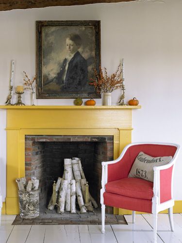 Two mismatched French-style armchairs became a pair, courtesy of tomato-hued upholstery and white paint. Painted Fireplace Mantels, Farmhouse Paint Colors Interior, Painted Fireplace, Paint Fireplace, Harvest Decor, Small Fireplace, Farmhouse Paint Colors, Double Sided Fireplace, Farmhouse Fireplace