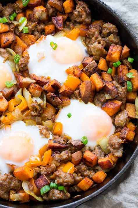 This skillet sweet potato hash with sausage and eggs is a filling, savory, healthy meal for any time of day.  Sweet potatoes, onions, peppers and sausage with eggs cooked right into the hash, it's Paleo and Whole30 friendly plus absolutely delicious! Great for brunch and breakfast for dinner! #cleaneating #paleo #whole30 Whole30 Sweet Potato, Sausage And Eggs, Whole30 Recipe, Paleo Running Momma, Arbonne Nutrition, Clean Meals, Sausage Potato, 30 Diet, Mini Hamburgers