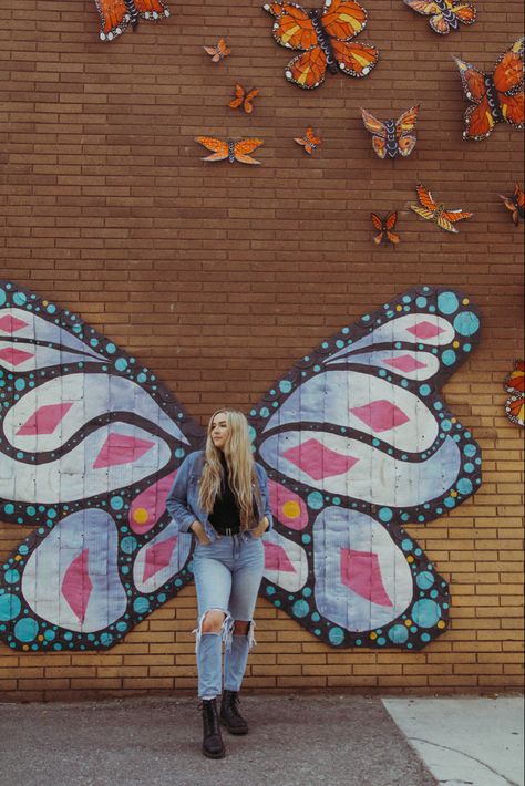 Butterfly murals in downtown Riverside, CA #photography #photoshootideas #murals #californiafashion Mural Wall Picture Poses, Poses With Murals, Senior Picture Ideas Murals, Mural Photoshoot Poses, Mural Poses, Mural Photoshoot, Butterfly Wall Painting, Downtown Riverside, Urban Senior Pictures