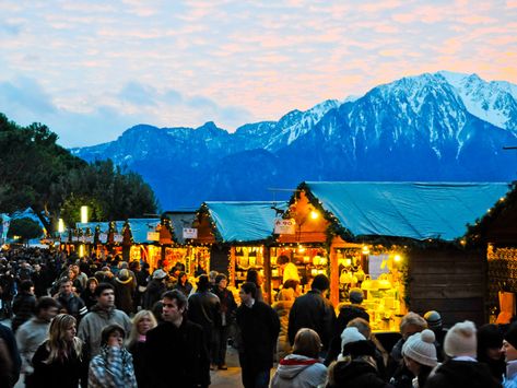 Montreux Christmas Market with Alps in the Background Geneva Christmas Market, Switzerland Christmas, Chalet Girl, Xmas Market, Christmas Destinations, Christmas In Europe, Best Christmas Markets, Christmas Markets Europe, Geneva Switzerland