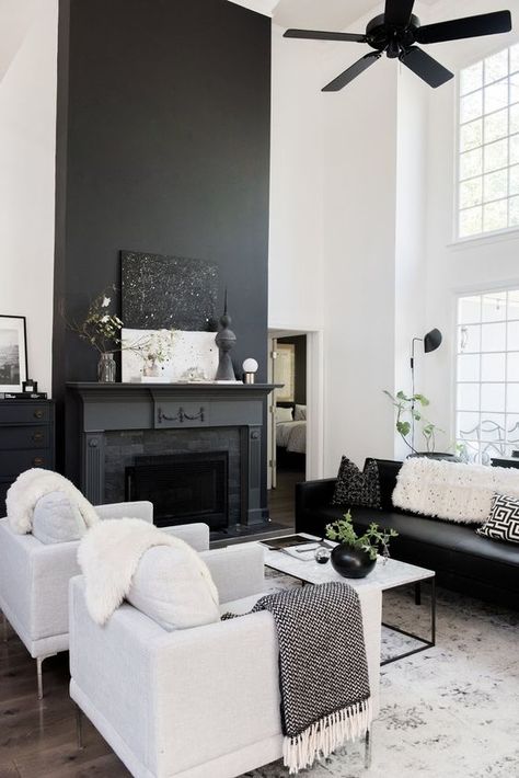 a Nordic living room with a black fireplace, black and white furniture, a black fan and a white coffee table Black And White Living Room Decor, Modern White Living Room, Georgia House, White Living Room Decor, Black And White Living Room, Black Fireplace, Nordic Living Room, White Living, White Living Room