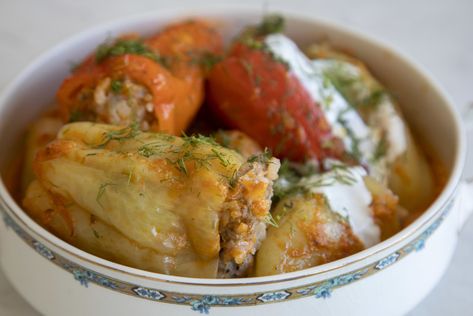 Stuffed bell peppers are one of the most popular dishes among Ukrainian home cooks, says Anna Voloshyna, San Francisco chef and author of the forthcoming cookbook, “Budmo! Recipes from a Ukrainian Kitchen” (Rizzoli, $40). The stuffing in Voloshyna’s recipe is a mixture of ground pork and medium-grain rice. But it’s the accompanying sauce, made with onions, tomatoes, grated carrots and a ... Bell Peppers Stuffed, Parboiled Rice, Popular Dishes, Deep Frying Pan, Canning Diced Tomatoes, Ukrainian Recipes, Piece Of Bread, Ground Pork, Bell Peppers