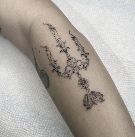 Want to feel like a victorian lady running through a dark hallway? Get a Candelabra tattoo🕯️👻!! This was custom made for my beautiful client Sarah🖤 I love doing funky and cute custom designs. If you would like to book a tattoo appointment please email me with that button above or fill out the book an appointment form on my website! I look forward to working with you ✨. #tattoo #finelinetattoo #singleneedletattoo #blackandgraytattoo #blackandgreytattoo #sandiegotattooartist #sandiegotattoosh... French Symbols Tattoo, Victorian Flash Tattoo, Candelabra Tattoo Design, Dark Victorian Tattoo, Tiny Sacred Heart Tattoo, Victorian Aesthetic Tattoo, Victorian Window Tattoo, Dainty Book Tattoos, Lady Tattoo Ideas