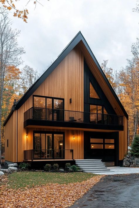 Contemporary split level house amidst autumn trees. Get ready to unravel the quirky charm and practical perks of split-level houses, where every flight of stairs is an adventure in style! A Frame Cabin With Garage, A Frame With Attached Garage, A Frame Garage, Cabin With Garage, Tahoe Cabin, Black Window Frames, Modern Residential Architecture, Stone Chimney, Dark Panels