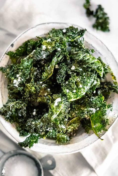 This kale chips recipe adds a crispy element to many a dish or a healthy alternative to the classic potato chip. Salt + delish! #kalechips #lowcarbkalechips Kale Chips Recipe Oven, Kale Chips Oven, Kale Chips Recipe Baked, Spinach Chips, Oven Roasted Zucchini, Kale Chips Recipe, Kale Chips Baked, Garlic Kale, Baked Kale