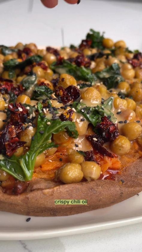 Sweet Potatoes With Tahini Butter Chickpeas The messy mix of tahini, chilli crunch and crispy chickpeas over soft sweet potatoes is divine… | Instagram Sweet Potatoes With Tahini Butter Chickpeas, Tahini Butter, Butter Chickpeas, Veggie Mains, Sweet Potato Hummus, Tahini Recipe, Chilli Oil, Sweet Potato Spinach, Crispy Chickpeas