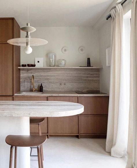 The Wooden Singleslab on this backsplash features a sleek, uniform design that can make a small kitchen or bathroom feel more spacious. This wooden cabinet will also balance the look. Wooden Singleslab Backsplash from @settingforfour #kitchenbacksplashideas #backsplash Travertine Countertops Kitchen, Travertine Backsplash Kitchen, Travertine Countertops, Amsterdam Apartment, Travertine Backsplash, Quartz Backsplash, White Kitchen Tiles, Marble Price, White Subway Tile Backsplash