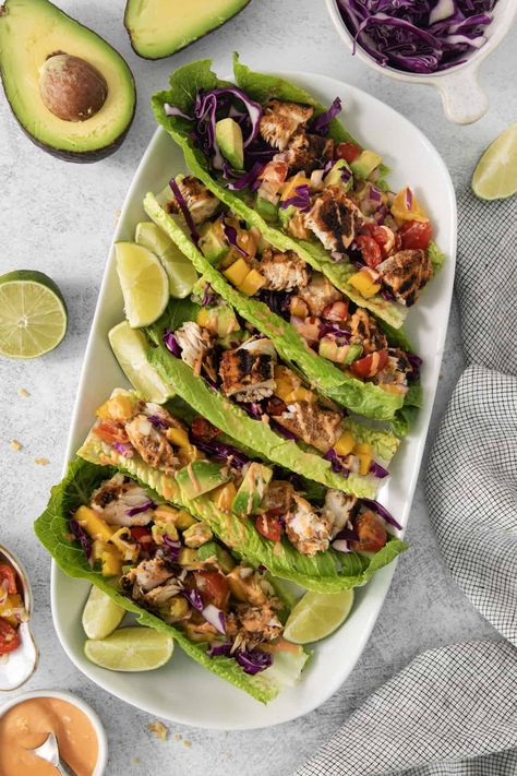 These Mahi Mahi Tacos with Tropical Salsa are the perfect low-carb, light, and healthy lunch or dinner. They're made with flaky grilled mahi mahi served on a lettuce wrap or corn tortilla, then topped with tropical salsa and Sriracha mayo. Mahi Mahi Fish Tacos, Tropical Salsa, Tropical Dinner, Mahi Tacos, Mahi Mahi Tacos, Grilled Mahi Mahi, Df Recipes, Sriracha Mayo, Lettuce Wrap