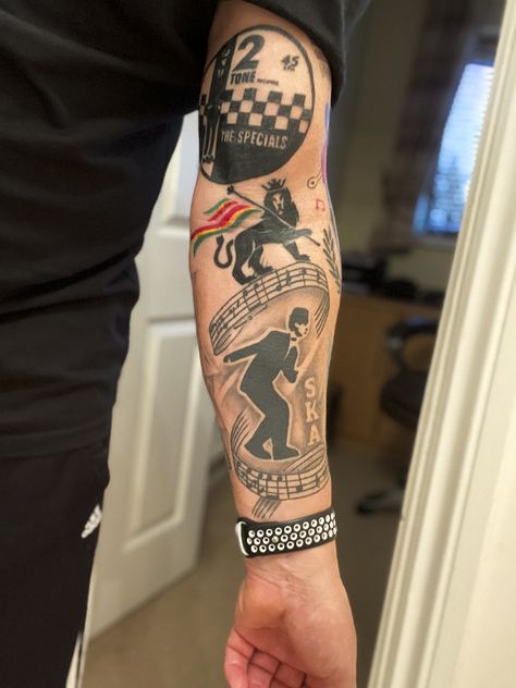 Ska/Reggae inspired tattoo sleeve coming along nicely.  Just added The Specials record label and another Lion of Judah! Ska Tattoo Ideas, Reggae Tattoo Ideas, Bob Marley Tattoo, Reggae Art, Ska Music, Skinhead Fashion, Finger Tats, Hawaiian Tattoo, Rude Boy