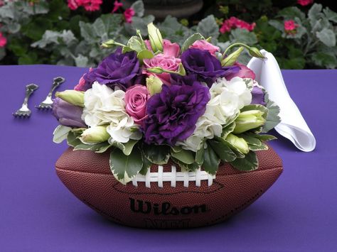 Weddings Table Setting Football Floral Arrangement, Rugby Themed Wedding, Nfl Wedding Ideas, Football Flower Arrangements, Sports Wedding Ideas, Tailgate Wedding, Football Wedding Theme, Football Centerpieces, Sports Themed Wedding