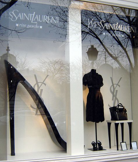 Yves Saint Laurent “High heel” window display Black and white. Spring-Summer 2007, Paris. it is a very well theme based, related line display. Since YSL, keeps its displays very minimal, this one justifies it very well, with the entire black and white concept and the products arranged in a directional manner. Ysl Store, Luxury Window Display, Luxury Retail Store, Saint Laurent Store, Fashion Window Display, Handbag Display, Windows Display, Fashion Showroom, Visual Merchandising Displays