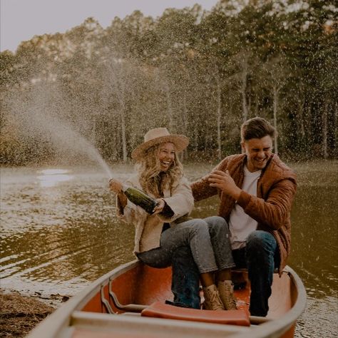 photoshoot couple ideas, canoe, popping champagne Couple In Canoe, Rowboat Couple Photoshoot, Fishing Boat Photoshoot, Family Canoe Photoshoot, Canoe Couple Photos, Fishing Boat Engagement Photos, Kayak Engagement Photos, Engagement Photos Canoe, Couple Canoe Pictures