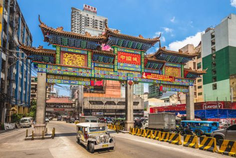 Binondo, Manila’s Chinatown, is the oldest Chinatown in the world and was established in the late 16th century. The name Binondo comes from a Tagalog word meaning ‘mountainous’, due to its hilly landscape. Within Binondo are many historical places of worship, all richly decorated in bright colours, gilded carvings and traditional Chinese architecture. Traditional Chinese Architecture, Nhs Nurse, Binondo Manila, Hilly Landscape, Places Of Worship, Historical Places, Red Bus, Poetry Book, Chinese Architecture