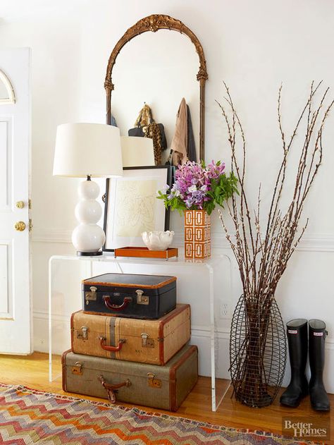 Take something as basic as antique suitcases and use them for a stylish storage option. The suitcases are perfect for storing small objects in a convenient, yet hidden location. Suitcase Decor, Suitcase Storage, Pretty Storage, Old Suitcases, Deco Nature, Vintage Suitcases, Foyer Decor, Foyer Decorating, Photo Decor