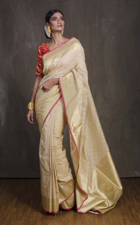 Semi Katan Silk Banarasi Saree in Cream and Gold Cream Banarasi Saree, Cream Saree Combination, Gold Banarasi Saree, Indian Wedding Reception Outfits, Gold Silk Saree, Cream Saree, Saree Pose, Gold Kada, Engagement Saree