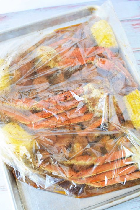 How to cook seafood in a bag in the oven! Crab boil in a Reynolds oven bag with corn, sausage and shrimp in 30 minutes tender with Old Bay. Seafood Boil Recipes Oven, Seafood Boil In Oven, Seafood In A Bag, Shrimp Boil Recipe Old Bay, Shrimp Boil In Oven, Crab Boil Recipe, Steamed Crab Legs, Cooking Crab Legs, Cooking Crab