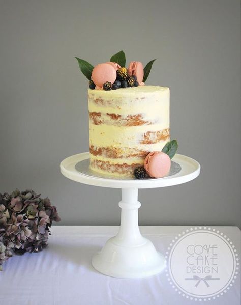 Chai spiced apple brown sugar cake with brown butter icing and blackberry jam, decorated with blackberry macarons, gilded berries and bay leaves Macaron Topped Cake, Naked Cake With Macaroons, Cakes With Macarons On Top, Cake With Macarons On Top, Pink Naked Cake, Wedding Cake Macarons, Naked Cake Design, Cake With Macaroons, Blackberry Macarons