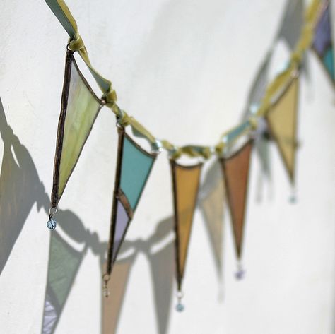 Stained glass garland inspires making a garland with cellophane paper. Stained Glass Banner, Stained Glass Bunting, Glass Garland, Stained Glass Garland, Cellophane Art, Stained Glass Wedding Decor, Stained Glass Wedding, Christmas Stained Glass Ideas, Swarovski Butterfly