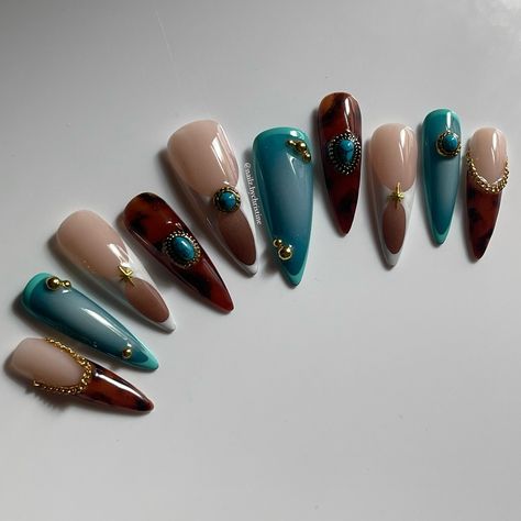 Gel-X Long Stiletto Press ons Animal print charms aura nails gold   Who knew tortie + turquoise would be a match made in heaven? 🩵 Raw photos no edits 😼 • ib// @miranaildit • • @apresnailofficial Long Stiletto Gel-X • @mostive Real Series (colours are listed under my reels post) • @lunabeauty_store dGEL Signature Fit No Wipe Topcoat and Jin.B GRACIA Crazy Top Thick to secure charms (DC:CHRISTINE10) • • • Dm orders are open only for Australian customers. Prices range from $110 AUD. #nailinspo #nailart #gelxnails #nailitdaily #stilettonails #melbournenailte... Gold Turquoise Nails, Turquoise And Brown Nails, Dc Nails, Zebra Print Nails, Nailinspo Nailart, Dragon Nails, Aura Nails, Turquoise Nails, Nails Gold