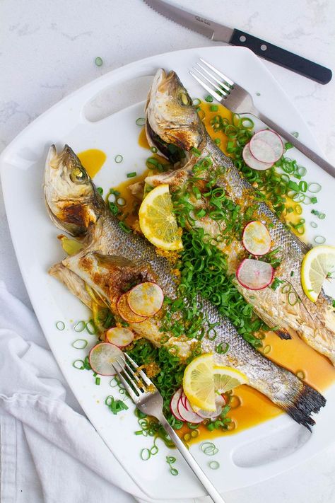 Top view of roasted branzino with scallion topping. Roasted Branzino Recipe, Roasted Branzino, Ponzu Sauce Recipe, Branzino Recipe, Ponzu Sauce, Main Course Recipes, Oven Cooking, Easy Delicious, Seafood Dishes