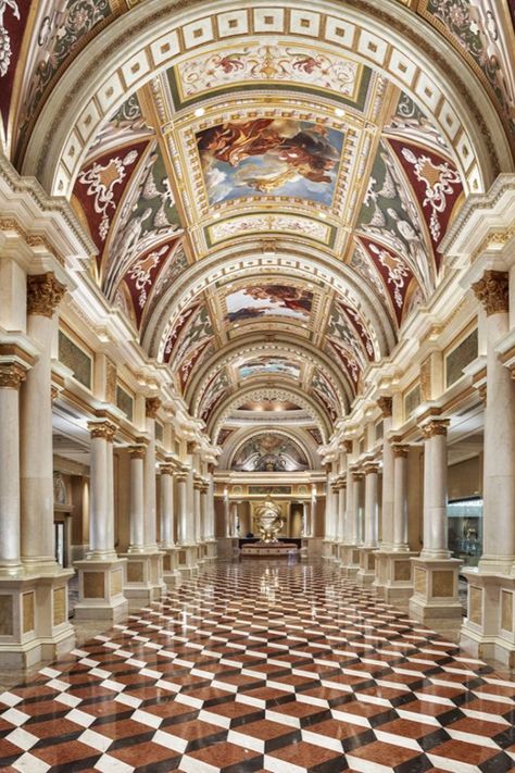 The Venetian Resort’s lobby is inspired in the city of Venice, with a golden sculpture of an armillary sphere at the centre, an instrument that was once used by astronomers in the Renaissance. The lobby has hand-painted ceiling frescoes illustrating Venetian paints, columns of Botticino marble, and graphic marble flooring. Versailles Ceiling, Venetian Palace Interior, Venice Palazzo Interior, Venetian Hotel Las Vegas Room, The Palazzo At The Venetian, Venetian Las Vegas, Las Vegas Travel Guide, Las Vegas Airport, Venetian Hotel