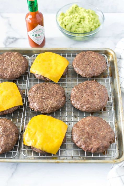 Don’t worry about grilling this winter. This simple, baked hamburgers recipe is perfect for a crowd and the patties are cooked in the oven at 425˚ for juicy, flavorful burgers that are ready for your favorite toppings. #burgers #hamburgers Oven Baked Hamburger Patties Ground Beef, Homemade Hamburgers In Oven, How Long To Bake Hamburger Patties In Oven, How To Cook Frozen Hamburger Patties, How To Cook Frozen Burgers In Oven, Bake Frozen Hamburger Patties Oven, Baked Burger Patties, Baked Frozen Hamburger Patties, How Long Do You Bake Hamburgers In The Oven