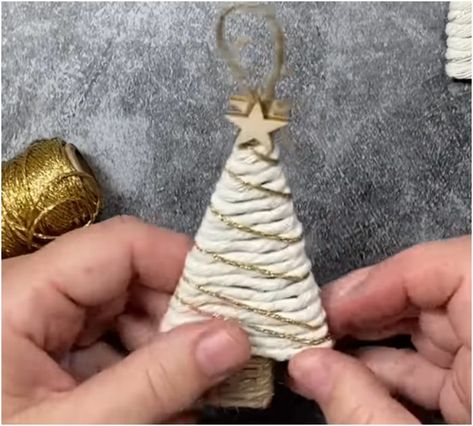 Gather yarn and twine to make these adorably rustic Christmas tree ornaments Christmas Tree Yarn Ornaments, Twine Christmas Tree Ornaments, Diy Rustic Tree Ornaments, Rustic Christmas Tree Ornament, Homemade Christmas Tree Garland Easy Diy, Easy Diy Christmas Tree Decorations, Yarn Christmas Ornaments Diy Crafts, Making Christmas Trees, Rustic Diy Christmas Ornaments