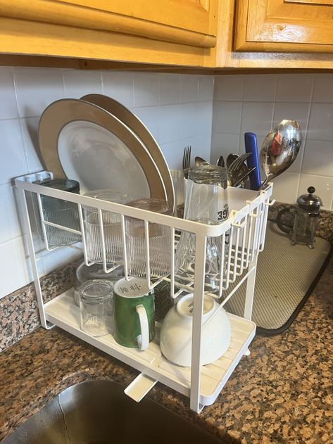 Yamazaki Two-Tier Dish Rack Review: I Tried It | Kitchn Hanging Kitchen Cabinets, Small Kitchen Hacks, Kitchen Tools And Equipment, Top Kitchen Gadgets, Creative Kitchen Gadgets, Dish Drying Rack, Essential Kitchen Tools, Small Kitchens, Dish Rack