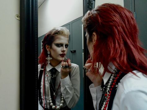 dressed to kill 📸 @gracevharper . . . . . . . . . . . #womeninsuits #blacktie #80sfashion red hair mullet wet look slicked back black tie white shirt alt alternative new wave new romantic androgynous androgyny punk goth gothic subculture 80s maximalist maximalism david bowie women in suits power suit suspenders braces chunky necklaces jewellery rings lipstick lip make up makeup mua editorial avant garde mirror pic photoshoot model modelling philosofay New Wave Hair 80's, 80s Maximalism Fashion, Shirt And Tie Outfit Women, Red And Black Lip Combo, Red Tie Outfit, Black Tie White Shirt, Red Hair Mullet, New Wave Outfits, 80s New Romantic