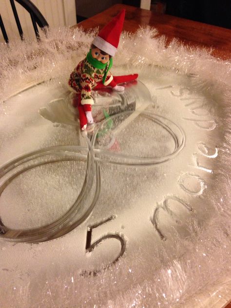 Our elf Rudy ice skating. Used spray snow and white garland over an old mirror that was sitting in the closet. This was one of my favorites! Elf On Shelf Ice Skating, Ice Skating Elf On The Shelf, Elf Ice Skating, Spray Snow, Elf Ideas Easy, White Garland, Elf Activities, Elf Antics, Old Mirror