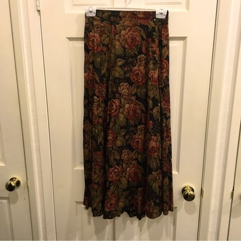 Orvis Multi Flowered Maxi Skirt Size 6 Red, Olive Green And Beige Flowers On A Black Background Side Buttons, Two On The Waistband, Four Buttons On The Upper Hip Back Waistband Fabric Gathered On An Elastic Band For Some Stretch The Skirt Fabric Is Gathered In The Back There Are Hoops For A Belt On The Waistband, But Not Noticeable If You Want To Go Without A Belt From A Smoke Free And Dog Loving Home Excellent Condition, Never Worn, But Isn’t The Pattern Beautiful! 12 1/2”-15” Waist 22” Hips 34” Length 45” Width At The Bottom From My Personal Vintage Fashion Collection Also For Sale On Poshmark Is Isra & Co Olive Brown Chic Lightweight Tunic And Ralph Lauren Green La Flower Maxi Skirt, Thrift Wishlist, Beige Flowers, Thrift Inspo, Teen Outfits, Skirt Fabric, Button Skirt, Brown Skirts, Lauren Green