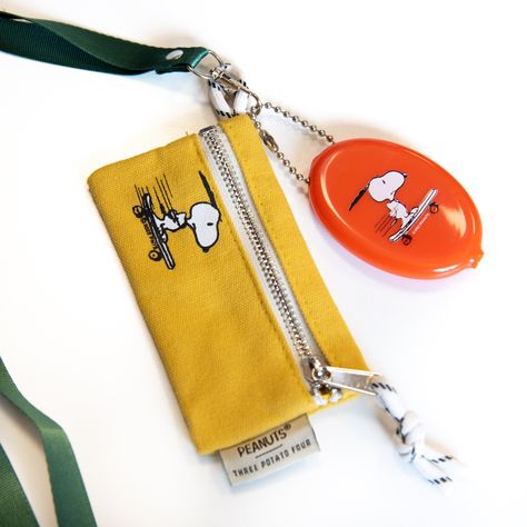 Classic mini zip pouch wallet with a loving touch of Snoopy nostalgia. Our zip pouches are made of durable, heavy duty canvas and made to keep all your little things safe and secure. Pouches feature optional lanyard attachment and easy open zipper pull and hanging loop.3" x 5"12 oz Durable Canvas Exterior + Nylon Cloth InteriorParacord Loop34" Lanyard Snoopy Wallet, Snoopy Skateboard, Orange Vinyl, Four X, Secret Safe, Pouch Design, Diy Sweatshirt, Felt Pennants, 카드 디자인