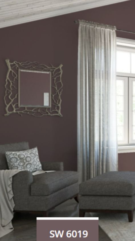 Poetry Plum wall color, a Sherwin-WIlliams Paint Color of the Year (SW-6019) painted on the bedroom walls near a comfortable chair & window. Poetry Plum Sherwin Williams, Sherwin Williams Purple Paint Colors, Plum Wall Color, Purple Walls Living Room, Purple Paint Colors Bedroom, Poetry Plum, Plum Living Room, Grey Purple Paint, Purple Paint Color