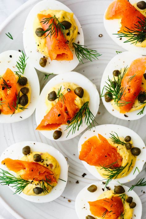 Smoked salmon deviled eggs takes this timeless appetizer to a whole other level. It's got fresh seaside vibes, tons of flavor, and looks extra pretty on a platter! Smoked Salmon Deviled Eggs, Salmon Deviled Eggs, Salmon Capers, Healthy Easter Recipes, Best Egg Recipes, Devilled Eggs, Keto Salmon, Bite Size Snacks, Smoked Salmon Recipes