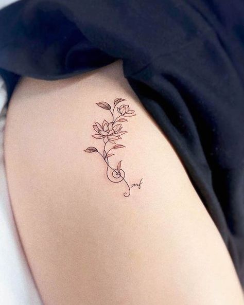 Wrap Around Music Tattoo, Music Family Tattoo, Musical Flower Tattoo, Music Tattoo With Flowers, Music Tattoo For Women, Lotus With Vines Tattoo, Long Lotus Flower Tattoo, Elegant Lotus Flower Tattoo, Music Tattoo Wrist