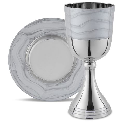 PRICES MAY VARY. Prestigious Kiddush Cup Set. High Polished Nickel Plated Goblet with Silver Lacquered Enamel on the Top of the Wine cup. Comes with a matching saucer plate decorated with Lacquered Enamel. This Kidush set will enhance your Shabbos and Yom tov meals. Mess Free: This fancy kiddish cup comes with a matching saucer designed with beautiful wavy pattern silver lacquered enamel throughout, architectured with a slump in the middle of the plate for the cup to sit firmly and wine to spill into. Leaving your Shabbos or Yom Tov Table spill free. Size Kosher for Passover and Kiddush - This stem foot elegant wine cup holds 6.5 ounces (192 ml) large enough to meet the halachic requirements for Kiddish, Havdalah, Passover Seder Four Cups of Wine. Cup measures 5.75" Inches Tall. Plate meas Pesach Seder, Kids Dishes, Elegant Wine, Kiddush Cup, Passover Seder, Judaica Gifts, Wavy Pattern, Wine Cup, Wine Cups