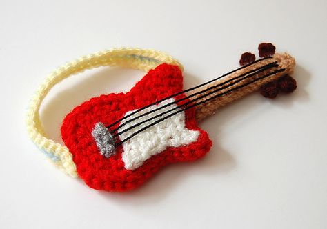 Amigurumi Guitar pattern for sale on Etsy https://www.etsy.com/listing/75185729/crochet-pattern-guitar?ref=sr_gallery_7&ga_search_query=Crochet+guitar+pattern&ga_order=most_relevant&ga_view_type=gallery&ga_ship_to=ZZ&ga_search_type=all Crochet Music, Guitar Patterns, Confection Au Crochet, Crochet Vintage, Haken Baby, Knitting Bags, Paintbox Yarn, Chale Crochet, Crochet Applique