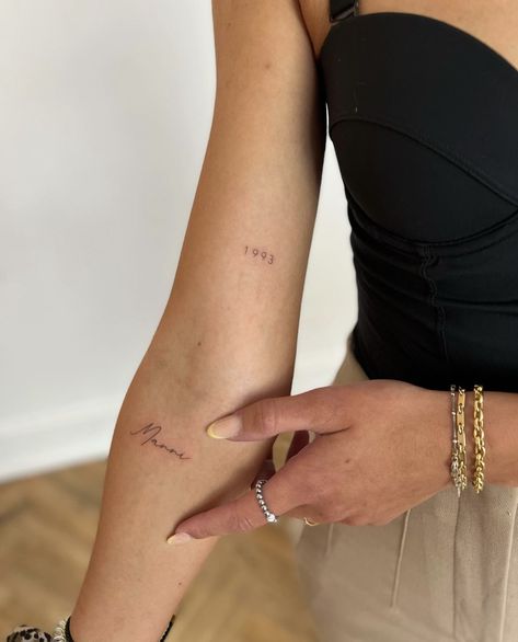 Year Tiny Tattoo, Arm Tattoos For Women Script, Fine Line Signature Tattoo, Date Tattoo Fine Line, Date Tattoo Above Elbow, Dainty Number Tattoo Placement, Lots Of Love Tattoo, Inner Arm Tiny Tattoo, Fine Line Birth Year Tattoo