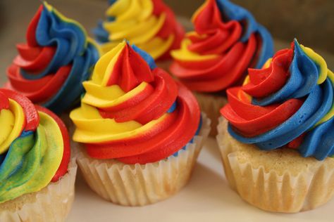 Red, Yellow and Blue cupcakes Red Blue Yellow Cake, Red Blue Yellow Birthday Party Themes, Sonic Birthday Theme Party Ideas, Sonic Birthday Cupcakes, Swirl Cupcakes, Green Cupcakes, Yellow Cupcakes, Red Cupcakes, Sonic Birthday Parties