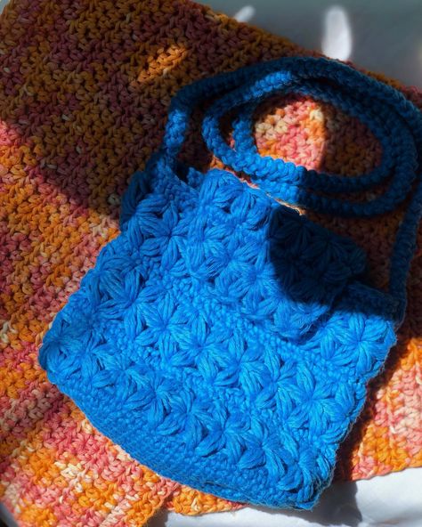 Once upon a stitch, in a world of crochet wonders, I stumbled upon the mesmerizing jasmine stitch (@nordicyarnart gave me her bandana pattern for free!). Its intricate dance on the yarn whispered tales of beauty and utility. Behold, my newest collection of crochet sling bags, each woven with the magic of the jasmine stitch. Oh! And help me to choose the best name for this latest collection ❤️🥰 Let the story begin! #CrochetTales #jasminestitch #handcraftedtreasures #crochetslingbag #cr... Jasmine Stitch Crochet Bag, Jasmine Stitch Crochet, Flower Crochet Bag, Crochet Sling Bag, Bandana Pattern, Jasmine Flower, Sling Bags, Cool Names, Crochet Ideas