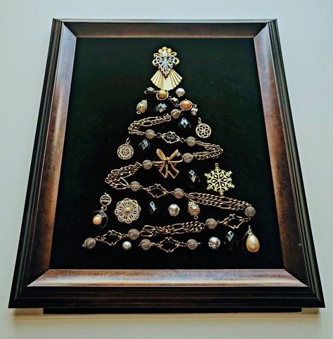 More Christmas Trees section from this shop:  https://www.etsy.com/shop/OddBeadsShoppe?section_id=45713888 Vintage Christmas Tree | Christmas tree in a frame | Christmas Tree | Christmas Tree Wall hanging | Christmas Gift What can be a better gift to yourself or your family members than a pretty vintage style Christmas Tree in a frame?  Made of beads and chains and jewelries, all carefully chosen and balanced in shapes and colors! The design is totally unique, this is a one-of-a-kind artwork, there are no exact copies of it. The elements of the Piece are attached properly and cannot be moved, replaced or detached. The piece is shipped as shown in a picture.  The vintage style frame is ready to hang on the wall or to be placed on your table on a shelf. There is no glass covering the item in A Frame Christmas, Christmas Button Crafts, Old Jewelry Crafts, Costume Jewelry Crafts, Jeweled Christmas Trees, Vintage Style Christmas, Frame Christmas, Vintage Jewelry Ideas, Jewelry Frames