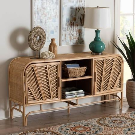 Foster an atmosphere of serenity in your space with the stunning Carabella storage cabinet. Made in Indonesia, this bohemian piece is handcrafted from natural rattan by skilled artisans. Two open shelves serve as a fantastic display area, while the doors open to reveal four additional shelves to organize and declutter busy areas of your home. The Carabella will arrive fully assembled and exhibits beautifully woven exteriors embellished with rattan pole for a captivating display in any layout. Serving as a fantastic solution to your needs in rustic style, the Carabella storage cabinet is sure to refresh any arrangement. Disclaimer: Rattan is a product of nature and may have variations in areas such as, but not limited to, color, pattern, grain and texture. The hair-like strands of rattan/ra Organize And Declutter, Accent Storage Cabinet, Display Area, Door Storage, Open Shelves, Tv Cabinet, Cabinet Furniture, Bar Furniture, Accent Furniture