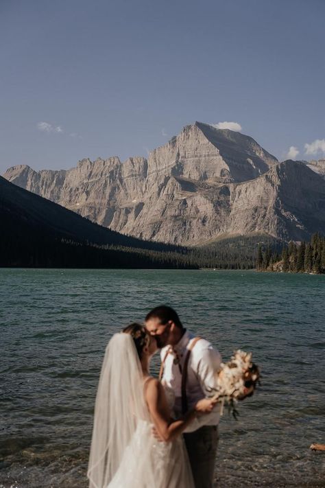 A romantic sunrise micro-wedding at Lake Josephine in Glacier National Park followed by hiking with friends and family. Blue skies, a lakefront first dance, and the dreamiest views. | Mountain micro-wedding, hiking elopement apparel, sunrise elopement, mountain wedding inspiration Elope In Glacier National Park, Small Wedding In The Mountains, Alpine Lake Elopement, Mountain Lake Elopement, Simple Nature Wedding, Lake Mcdonald Montana, Eloping Ideas, Mountaintop Elopement, Views Mountain