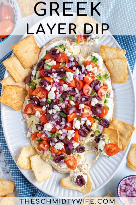 A Mediterranean inspired twist on a layered dip! Greek Layer Dip is perfect for any party. This crowd pleasing appetizer is made with many layers including hummus, greek yogurt, cucumber, artichokes, feta cheese, and more! Greek Layered Dip Tortellini Skewers Appetizers, Bean Nachos Recipe, Greek Hummus Dip, Taco Appetizers, Parmesan Baked Potatoes, Greek Layer Dip, Cucumber Snacks, Layered Dip, Baked Shrimp Recipes